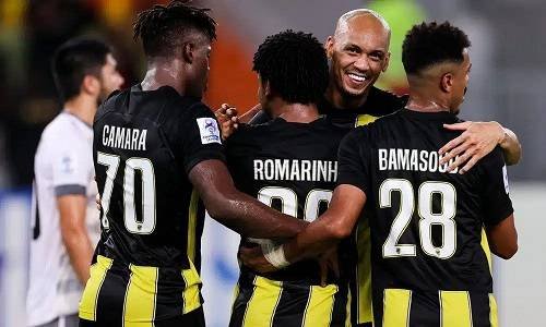 • Players of Al-Ittihad celebrating their victory