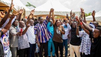 Mrs Ernestina Owusu-Banahene raising the hand of Dr Adutwum to declare him elected after the acclamation at Jachie on Saturday