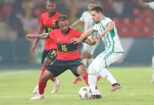 • Algeria midfielder, Bernacer (in white) takes on an Angolan player