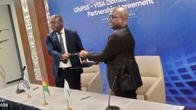 Mr Hesse (left) exchanging the partnership agreement with Mr Uaboi