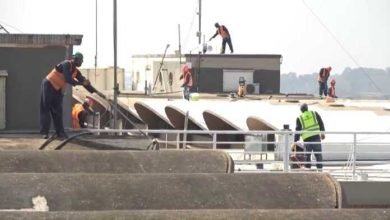 • Workers at the KATH rehabilitation project