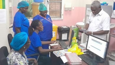 • Mr Nartey (right) paying the bills of the detained mothers