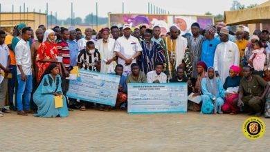• Alhaji Farouk Aliu Mahama (middle, in cap) with the beneficiaries and their parents