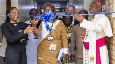 Dr Oyeyinka (left) and Dr Maite Alfonso Romero, cutting the tape to open the facility that houses the MRI Scanner. Looking on are Most Rev Afrifah-Agyekum (right) and other dignitaries.