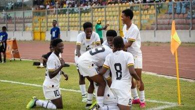 Members of the Black Princesses celebrate after scoring one of the goals