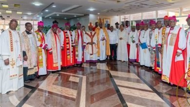 • President Akufo-Addo (middle) with the clergy after the Presidential New Year Eucharist Service