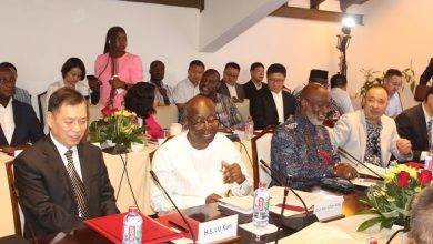 Mr Ken Ofori-Atta (second from left) interacting with Ambassador Lu Kun (left) at the programme. Photo. Ebo Gorman