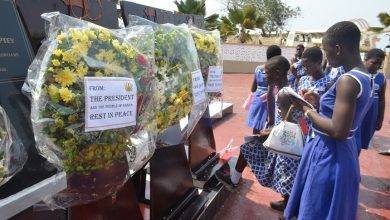 Some students scribbling down some notes after the wreath laying ceremony. Photo Godwin Ofosu-Acheampong..