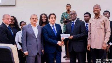 • Mr Kheir (middle) making a presentation to Professor Daniel Ofori during the ceremony