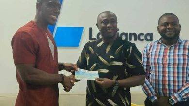 • Mr Gadegbeku (left) presenting the cheque to Mr Addai