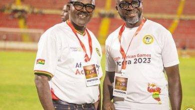 Dr Ofosu Asare (left) and a member of the LOC