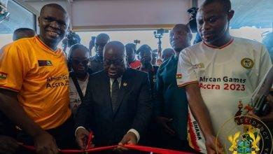 President Akufo-Addo (middle) cutting a tape to officially open the Borteman Sports Complex facility