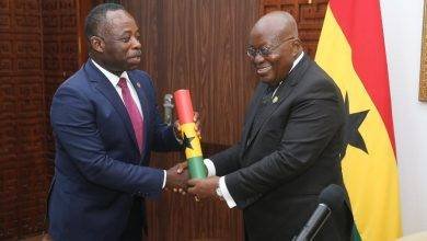President Akufo-Addo(right) presenting the instrument of office to Dr. Evans Aggrey-Darkoh, Head of Civil Service at the Jubilee House