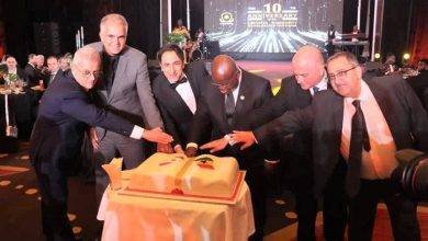 • President Akufo-Addo (third from right), Mr Maher Kheir (third from left) and other dignitaries cutting the anniversary cake