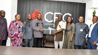 • Mr Boadu (third from left) receiving corporate souvenir from Mr Addo