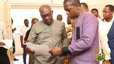 Mr Nkrumah (left) interacting with the contractor undertaking rehabilitation works on the facility