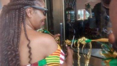 • Dr Mrs Odame (inset) cutting the tape to open the auditorium