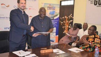 Mr Steffen Kuhl,MD,Investing For Employment, exchanging the signed document with Mr Alexie Kwasi Fosu, Executive Director Prefos while other look on. Photo Godwin Ofosu-Acheampong