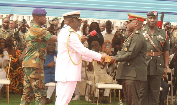 Vice Admiral Seth Amoama (left), the outgoing CDS handing over the symbol of authority to Maj. Gen. Thomas Oppong-Peprah at the farewell parade. Photo. Ebo Gorman