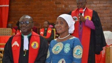 Rt. Rev. Edusa-Eyison (with microphone) introducing Rev. Mintah and the spouse to the congregation during the inauguration 
