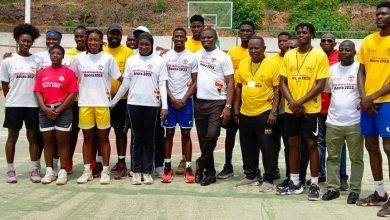 The Sports Minister (arrowed) in a pose with the national 3x3 basketball team