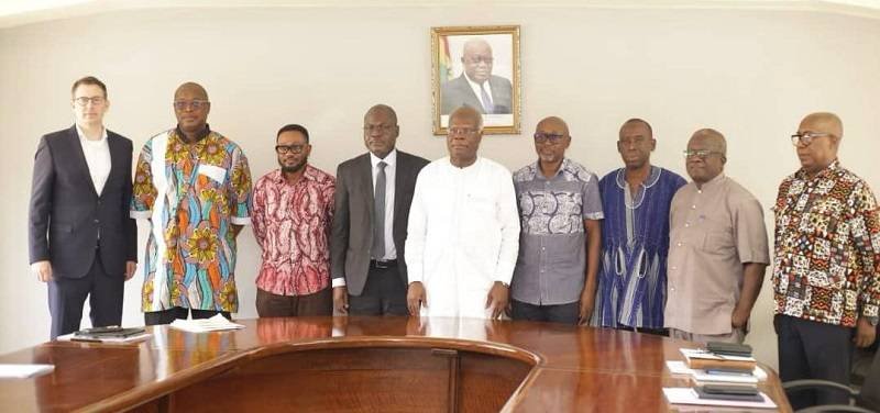 Mr Hammond fanked on the left by Prof. Dodoo with other members of the Committee