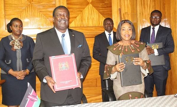 • Ms Shirley Ayorkor Botchwey (right) and Dr Musalia Mudavadi showing copies of the agreement document Photo: Ebo Gorman