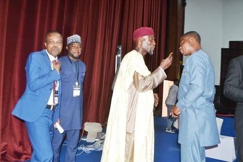 Sheikh Armiyawo Shaibu (third from left) in a chat with Mr Tengey during the summit Photo: Victor A. Buxton