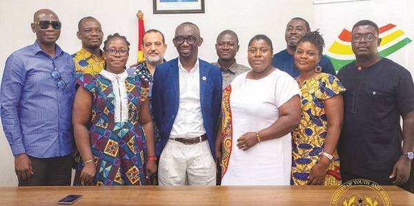 Dr. Baah-Nuakoh (in suit) flanked by members of the LOC