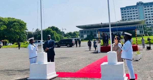 Mr Ampratwum Sarpong (left) hoisting the flag at the programme Photo Stephanie Birikorang