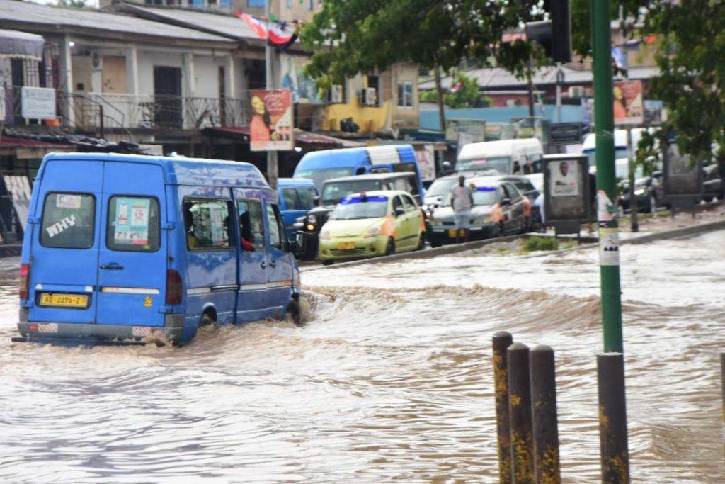 A vehicle stuck in the floods at Kaneshie first light in Accra