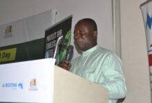 • Dr Kwadwo Ansong Asante (inset) speaking at the programme