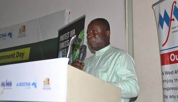 • Dr Kwadwo Ansong Asante (inset) speaking at the programme