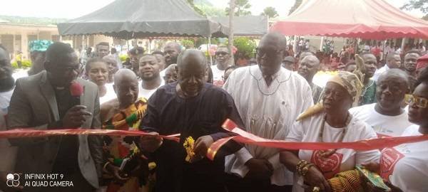 • Inset: Torgbui Xornametor (third from left) being assisted to cut the tape to open the facility