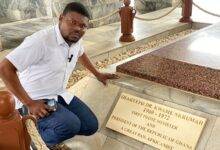 • Dr Jean-Emmanuel Gnagnon by the tomb of Osagyefo Dr Kwame Nkrumah