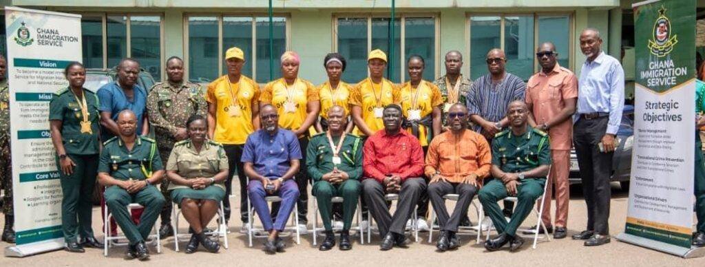 • Coach Larkyne (standing third from left) and Edward Asamoah (fourth from right) with officials of GIS