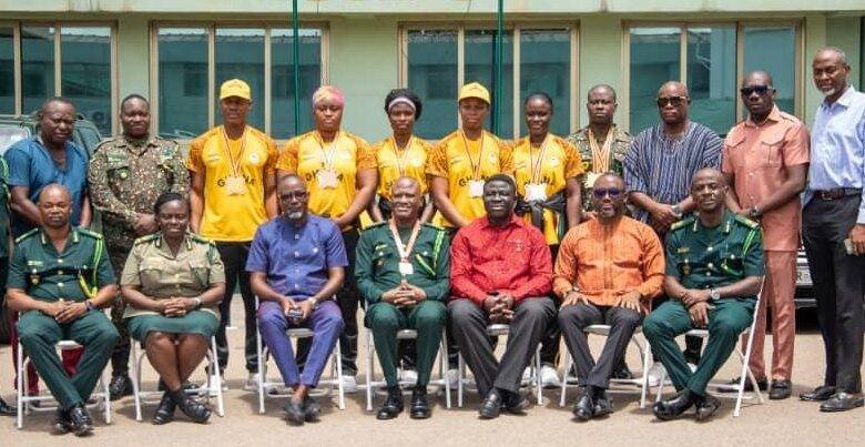 • Coach Larkyne (standing third from left) and Edward Asamoah (fourth from right) with officials of GIS