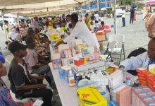 • A health officer (right) attending to a woman during the screening exercise