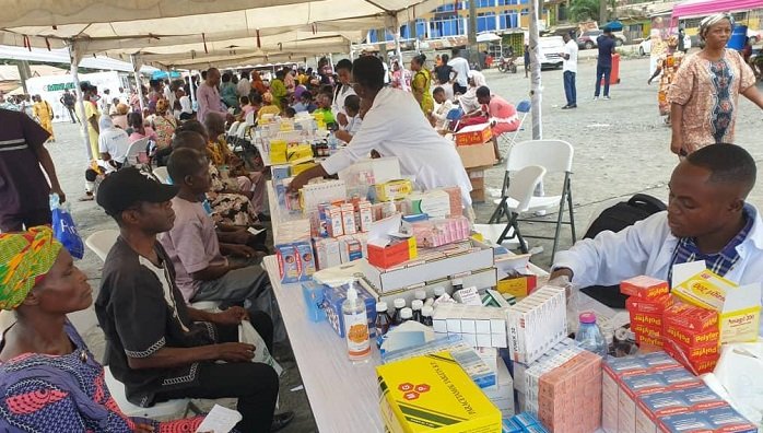 • A health officer (right) attending to a woman during the screening exercise