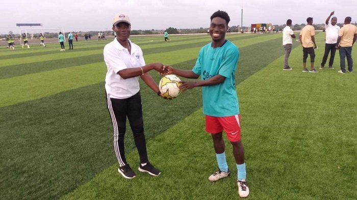 • Hattrick hero Ezekiel Appiah of Ashaiman receives the match ball from Match Commissioner Abigail Sowah