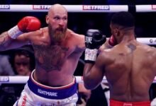 • Helenius (left) in action against Anthony Joshua