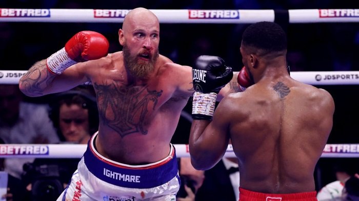 • Helenius (left) in action against Anthony Joshua