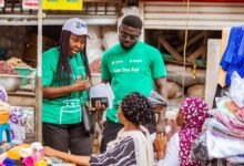 • Mrs Nyarko (left) and another official speaking to some market women