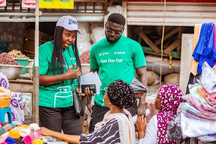 • Mrs Nyarko (left) and another official speaking to some market women