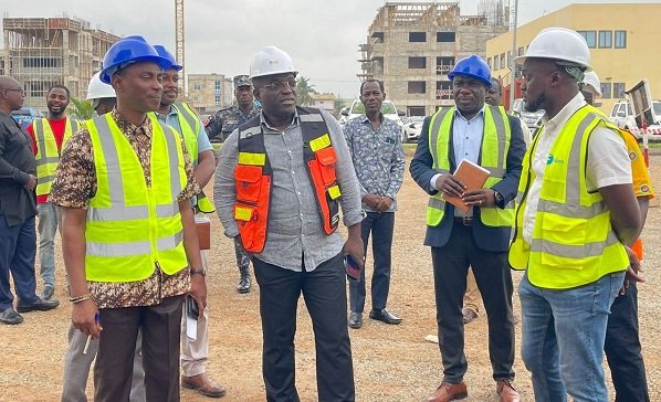 • Mr Adjei-Mensah Korsah (second left) and his team during the visit to the institute