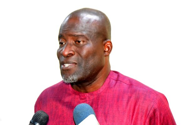 Mr Titus Glover (inset) addressing the members in the meeting Photo: Seth Osabukle