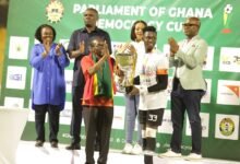 • Mr Kingsford Alban Bagbin presents the trophy to Kotoko's skipper, Frederick Asare