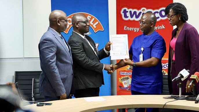 Mr Okai-Mensah (second from left) presenting the certification to Mr Tettey