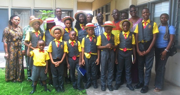 • Mr Norman Cooper (fifth from right) with the Pupils and the teachers Photo: Okai Elizabeth