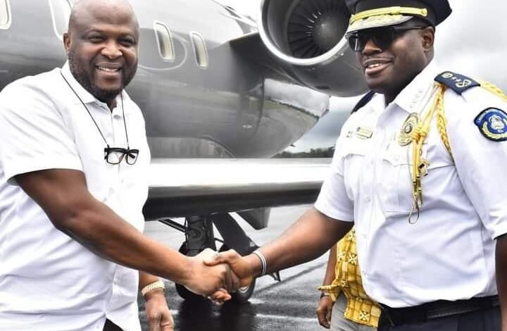 Mr Mahama (left) handing over the vehicles to Liberian authorities